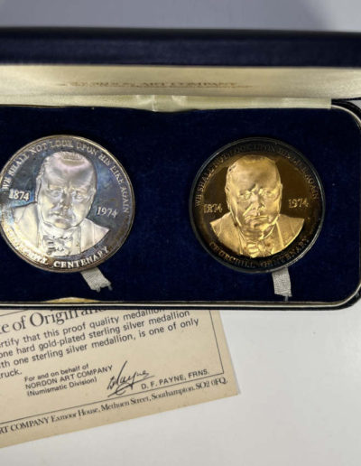 Cased pair of silver medals with COA